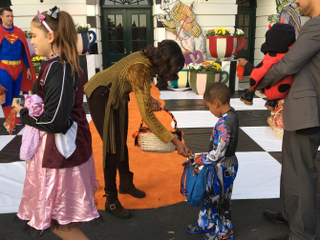 First Lady Michelle Obama with Robeson Perry, 5, at Trick or Treat at the White House, Oct. 31, 2016